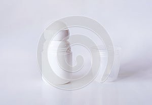 Mock up a bottle of deodorant with shadow. Front. Light background