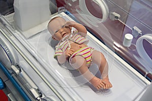 Mock-up of a child in an intensive care incubator