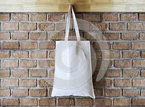 Mock up Cotton Tote Bag on Brick wall Background