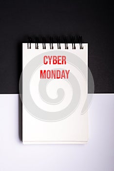 Mock up cyber monday sale with note pad on black and white background