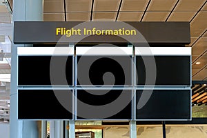 Mock up of departure and arrival information billboard in airport. Flight schedule board multiple displays for comping purpose. photo