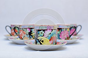 Mock up / design set of elegant and traditional colorful coffee cup & Tea cup on cup`s plate , drink-ware , kitchen isolated on wh