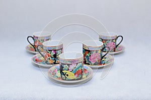 Mock up / design set of elegant and traditional colorful coffee cup & Tea cup on cup`s plate , drink-ware , kitchen isolated on wh