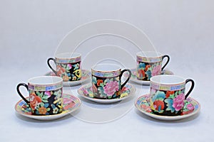 Mock up / design set of elegant and traditional colorful coffee cup & Tea cup on cup`s plate , drink-ware , kitchen isolated on wh