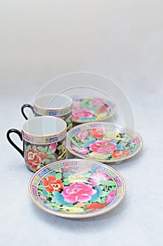 Mock up / design set of elegant and traditional colorful coffee cup & Tea cup on cup`s plate , drink-ware , kitchen isolated on wh