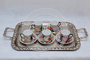 Mock up / design set of elegant and traditional colorful coffee cup & Tea cup on cup`s plate , drink-ware , kitchen isolated on wh