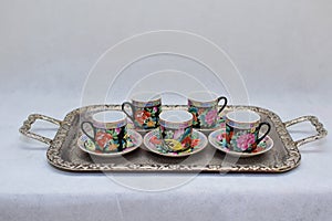 Mock up / design set of elegant and traditional colorful coffee cup & Tea cup on cup`s plate , drink-ware , kitchen isolated on wh