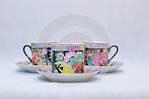 Mock up / design set of elegant and traditional colorful coffee cup & Tea cup on cup`s plate , drink-ware , kitchen isolated on wh