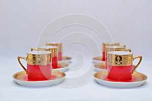 Mock up / design set of elegant and traditional colorful Red and gold traditional elegant coffee cup & Tea cup on cup`s plate besi