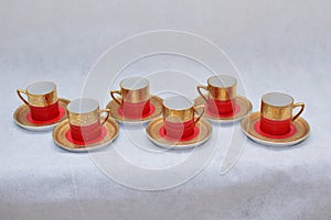 Mock up / design set of elegant and traditional colorful Red and gold traditional elegant coffee cup & Tea cup on cup`s plate besi