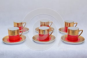 Mock up / design set of elegant and traditional colorful Red and gold traditional elegant coffee cup & Tea cup on cup`s plate besi