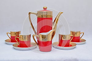 Mock up / design set of elegant and traditional colorful Red and gold traditional elegant coffee cup & Tea cup on cup`s plate besi