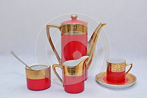 Mock up / design set of elegant and traditional colorful Red and gold traditional elegant coffee cup & Tea cup on cup`s plate besi