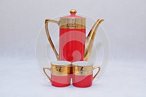 Mock up / design set of elegant and traditional colorful Red and gold traditional elegant coffee cup & Tea cup on cup`s plate besi