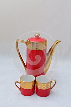 Mock up / design set of elegant and traditional colorful Red and gold traditional elegant coffee cup & Tea cup on cup`s plate besi