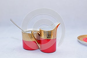 Mock up / design set of elegant and traditional colorful Red and gold traditional elegant coffee cup & Tea cup on cup`s plate besi