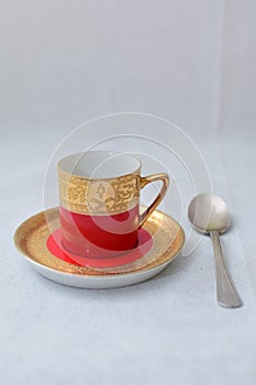 Mock up / design set of elegant and traditional colorful Red and gold traditional elegant coffee cup & Tea cup on cup`s plate besi