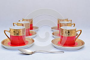 Mock up / design set of elegant and traditional colorful Red and gold traditional elegant coffee cup & Tea cup on cup`s plate besi