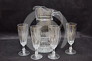 Mock up  design set of elegant and traditional drink ware / drinking glass & Jar for wine or juice, transparent isolated on black