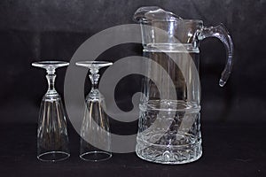 Mock up  design set of elegant and traditional drink ware / drinking glass & Jar for wine or juice, transparent isolated on black