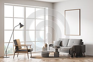 Mock up empty poster on the wall. Modern living room interior. Wooden floor and stylish furniture. Concept of contemporary design
