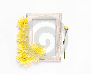 mock up empty wooden frame with yellow flowers on white background.