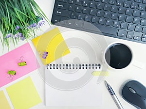 Mock up flat lay of office workspace desk with coffee,blank notebook, electronic devices and computer. organizer mockup concept