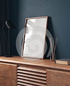 Mock-up frame in dark blue home interior with chest of drawers and decor