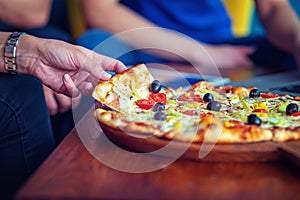 Mock up freelancer workplace. Tablet PC, cell phone and pizza. Top view image. Fast pizza delivery