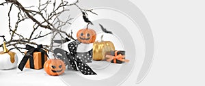 Mock up Halloween background with gifts, pumpkins and scary tree branches on white.