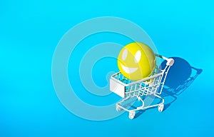 Mock up hapiness emoticon ball on cart,trolley for supermarket shopping concepts idea