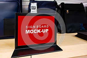 Mock up horizontal sign board on shelf space of bag