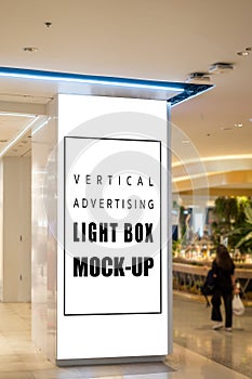 Mock up light box on pole at walkway in shopping mall