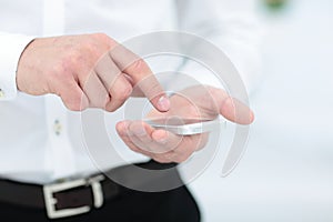 Mock up of a man holding device and touching screen