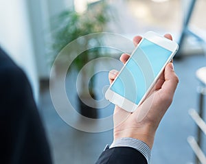 Mock up of a man holding smartphone