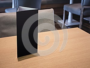 Mock up Menu Black sign stand on Table Bar restaurant cafe