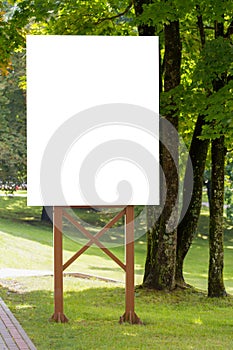 Mock up. Outdoor advertising, blank billboard outdoors, public information board in the park