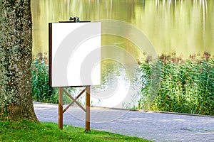 Mock up. Outdoor advertising, blank billboard outdoors, public information board in the park