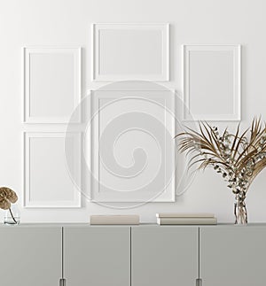 Mock-up poster frame with plants and chest of drawers standing near wall, Scandinavian style