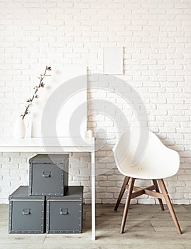 Mock up poster frame on table on white brick wall background