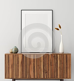 Mock up poster frame on wooden cabinet in home interior