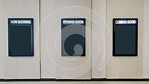 Three Mock up poster frames on Cinema wall