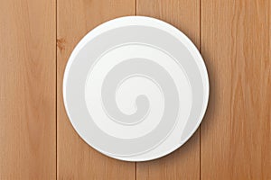 Mock-up of a round white sticker on a wooden background