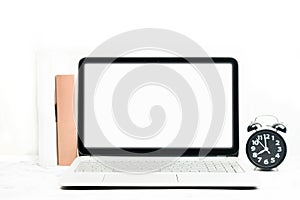 Mock up screen on laptop and alarm clock with white background