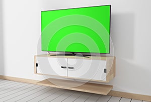 Mock up Smart Tv Mockup with blank green screen hanging in modern white empty room interior minimal designs. 3d rendering