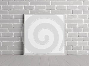 Mock up of square white frame on the floor with white brick wall