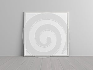 Mock up of square white frame on the floor with white wall