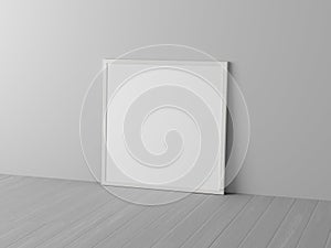 Mock up of square white frame on the floor with white wall