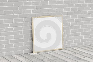 Mock up of square wooden frame on the floor with white brick wall