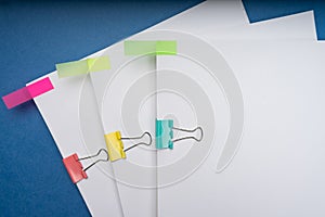 Mock up, stack of papers documents in archives files with paper clips on desk at offices, business concept. Copy space